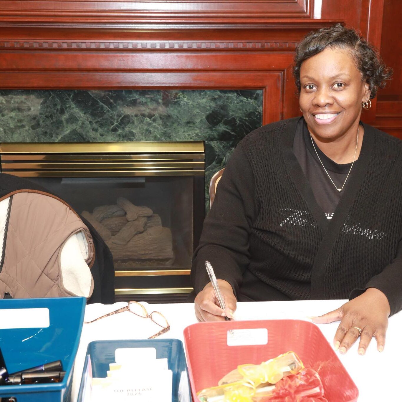 Volunteer sitting at a table